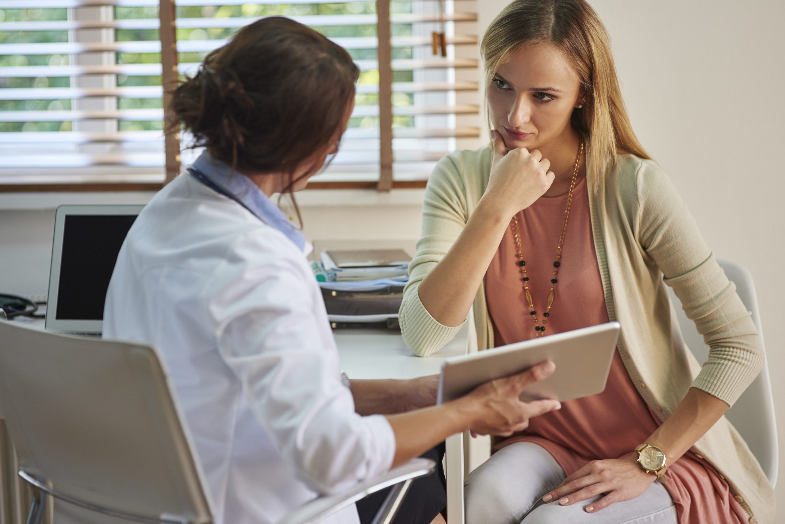 serious woman her visit doctor